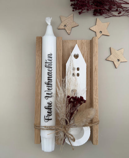 Weihnachtsgeschenk mit Kerze Frohe Weihnachten und Haus